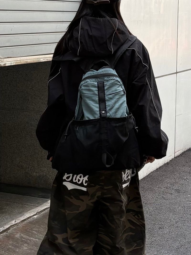 dual pocket mesh backpack