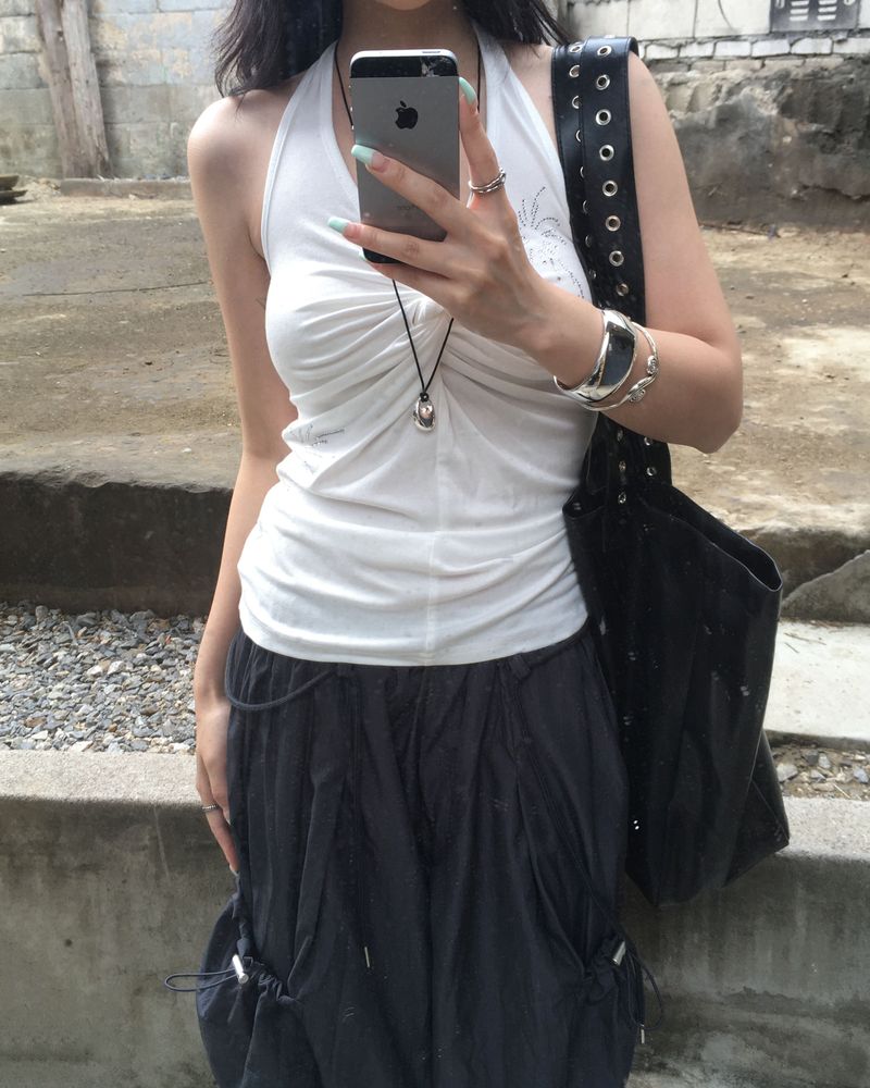 Cubic twisted sleeveless