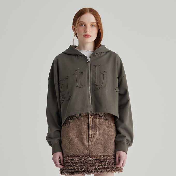 ANDTHEOTHER(アンドジアザー)の「KHAKI EDGE LOGO HOOD ZIP-UP(Tops)」