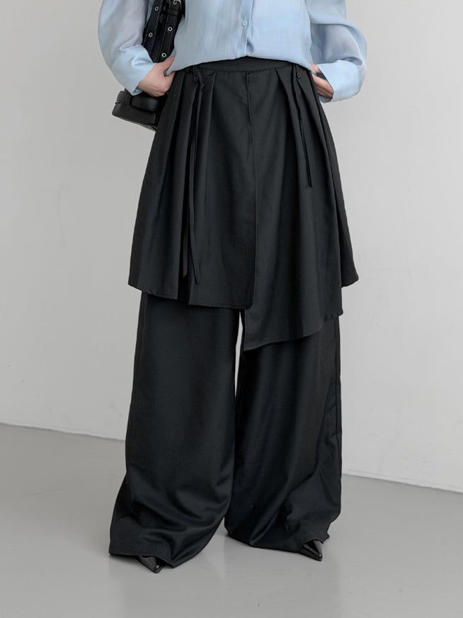mnem（ムネム）の「(Unisex) Tre Maxi Strap Wrap Slacks（Pants）」