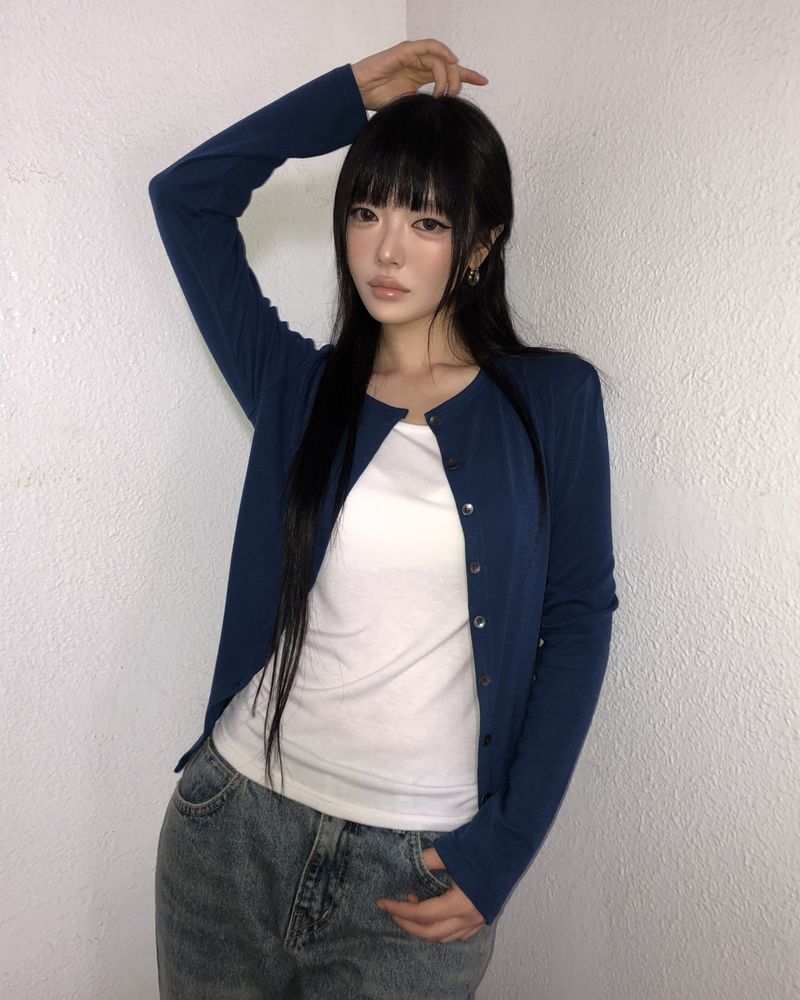 WONDER WONDER（ワンダーワンダー）の「レイヴン ボタン カーディガン（トップス）」