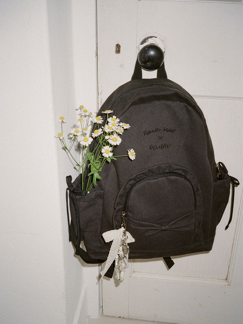 ovuni（オーブニ）の「Ruffle ribbon backpack_vintage black（Bags）」