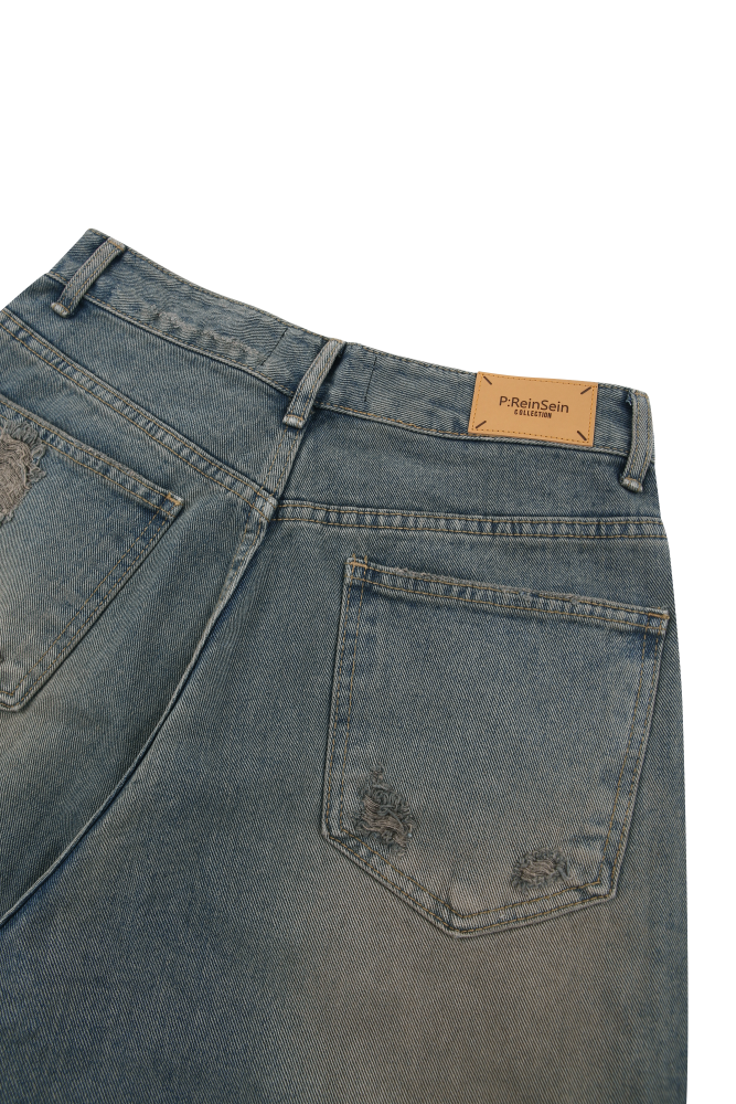 Dust washing damaged denim pants