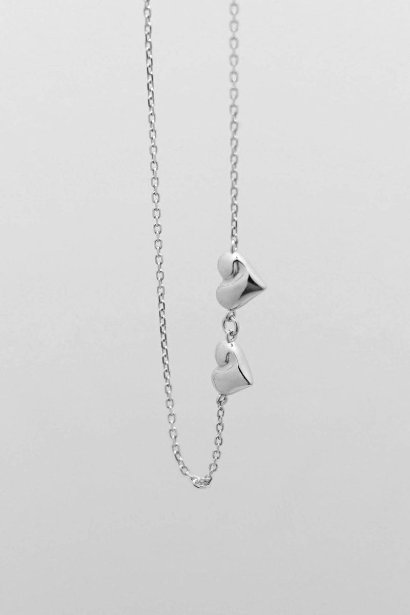 Two heart symbol necklace