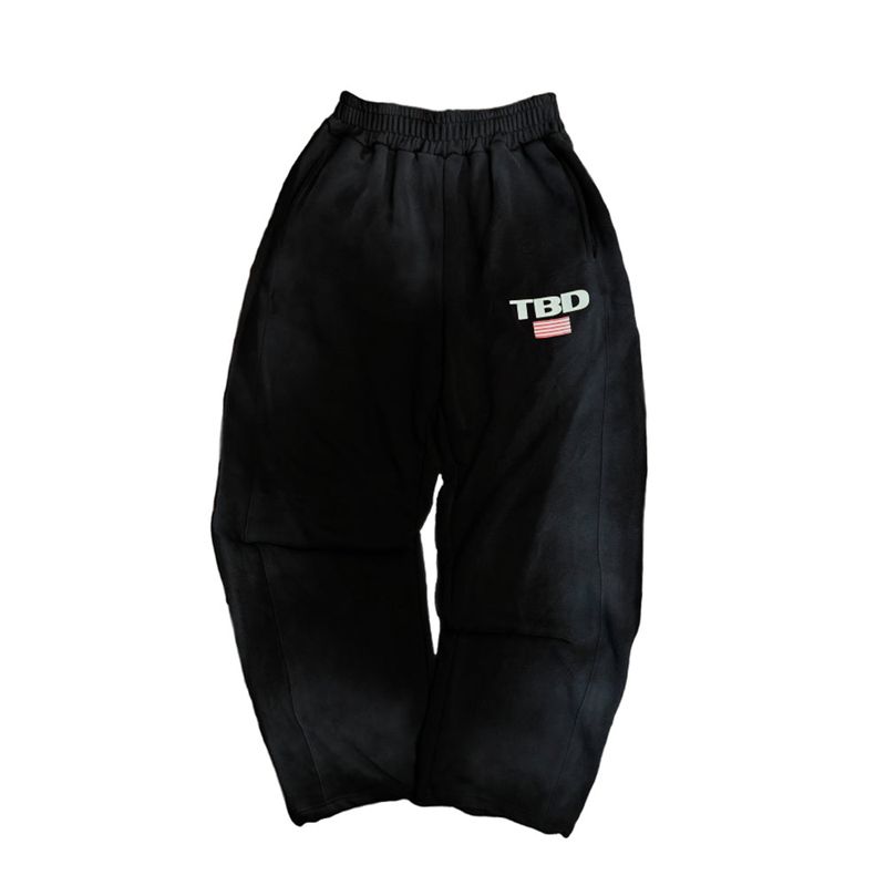 TOM'S BIRTHDAY（トムズバースデー）の「TBD World Logo Spray Jogger Pants Black（Pants）」