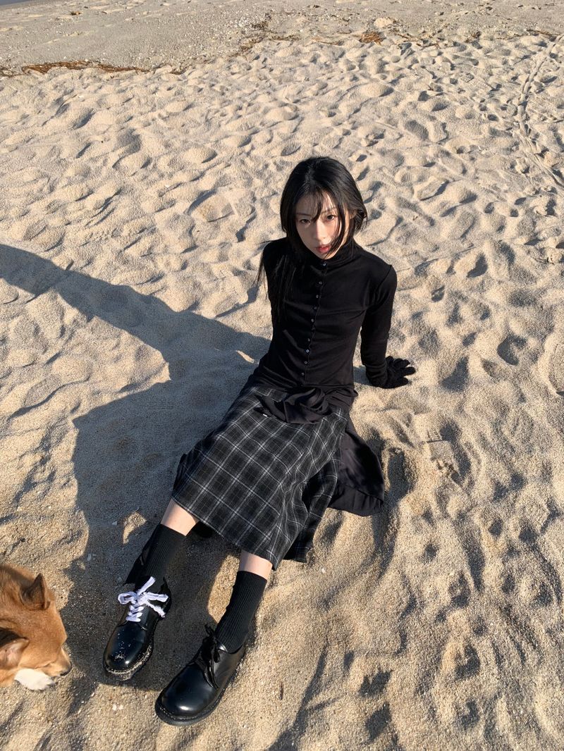 A BLACK CHECK SKIRT