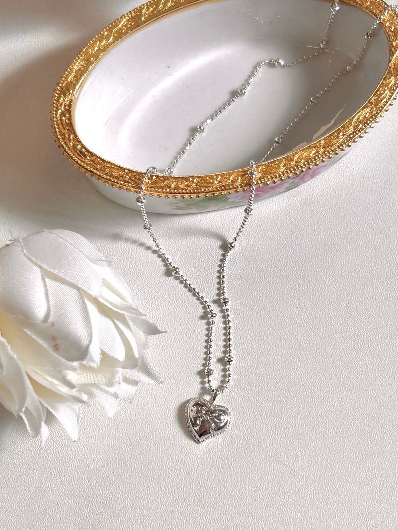 DANI（ダニ）の「Ribbon Heart Necklace（Accessories）」