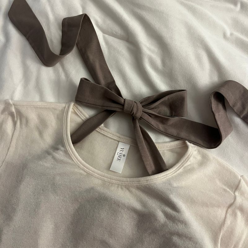 Yuheelee（ユヒリ）の「WAVE EDGE ROUND NECK BASIC TENCEL TOP / IVORY（Tops）」