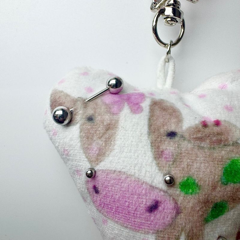 Pierced pinky cow keychain