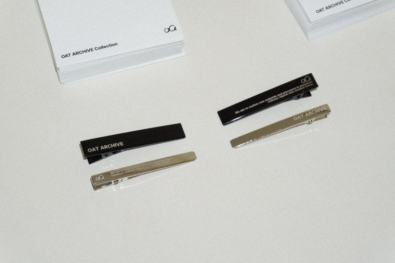 Black logo hair pin