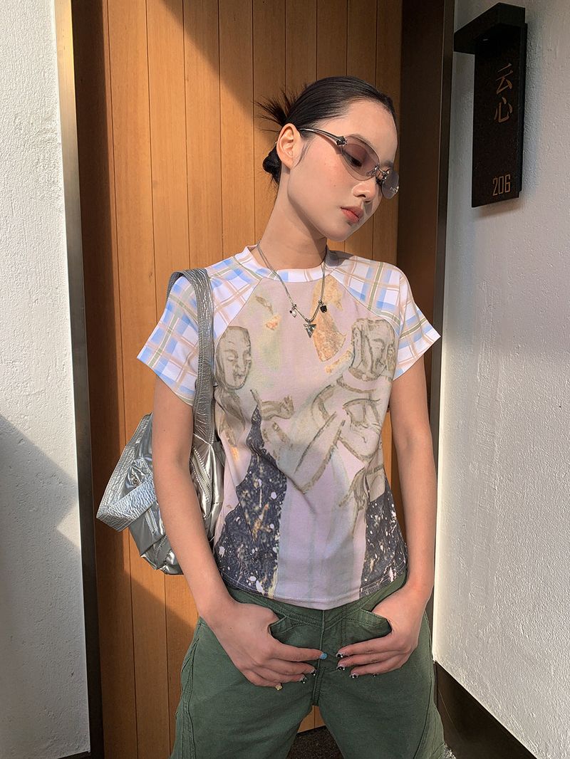 dereborujo（ドレボルゾー）の「Creed Painting Short-Sleeved Raglan T-Shirt（Tops）」