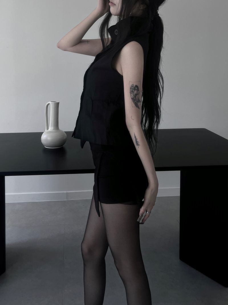 high-neck black button vest