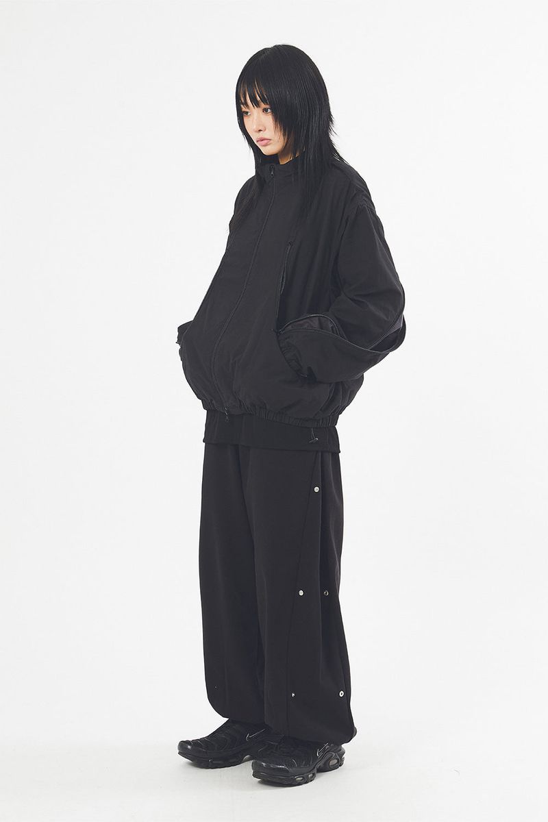 Multi curved line zip-up jumper