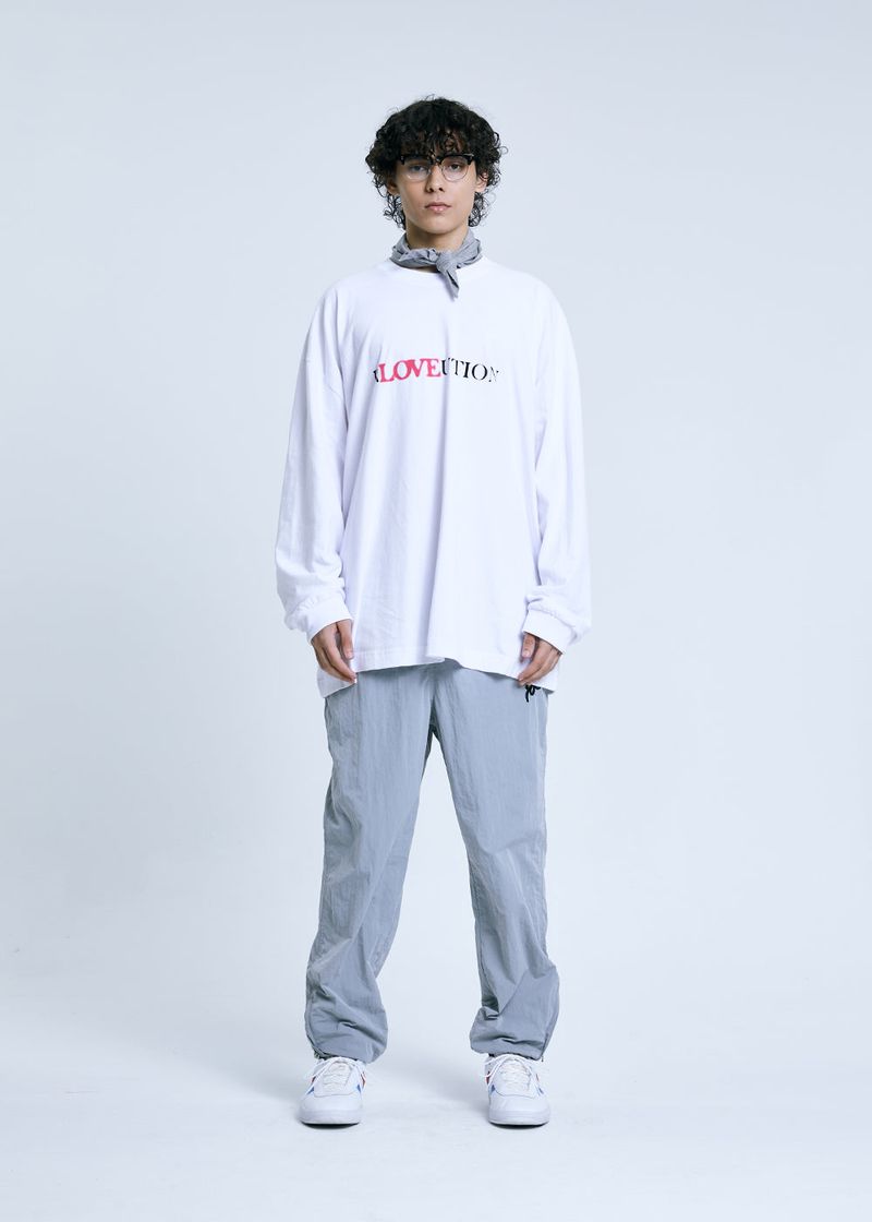 GRAFFITIONMIND（グラフィティオンマインド）の「RLOVEUTION LONG SLEEVE T-SHIRT_WHITE（Tops）」