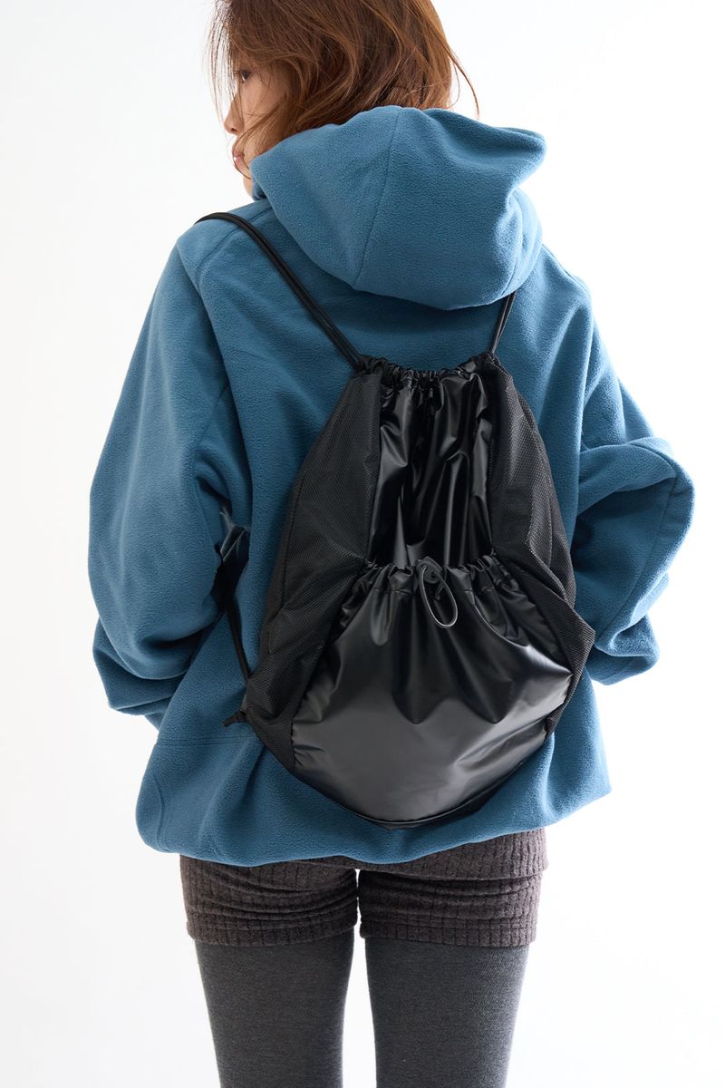 Raucohouse（ラウコハウス）の「Metallic panel drawstring backpack（Bags）」