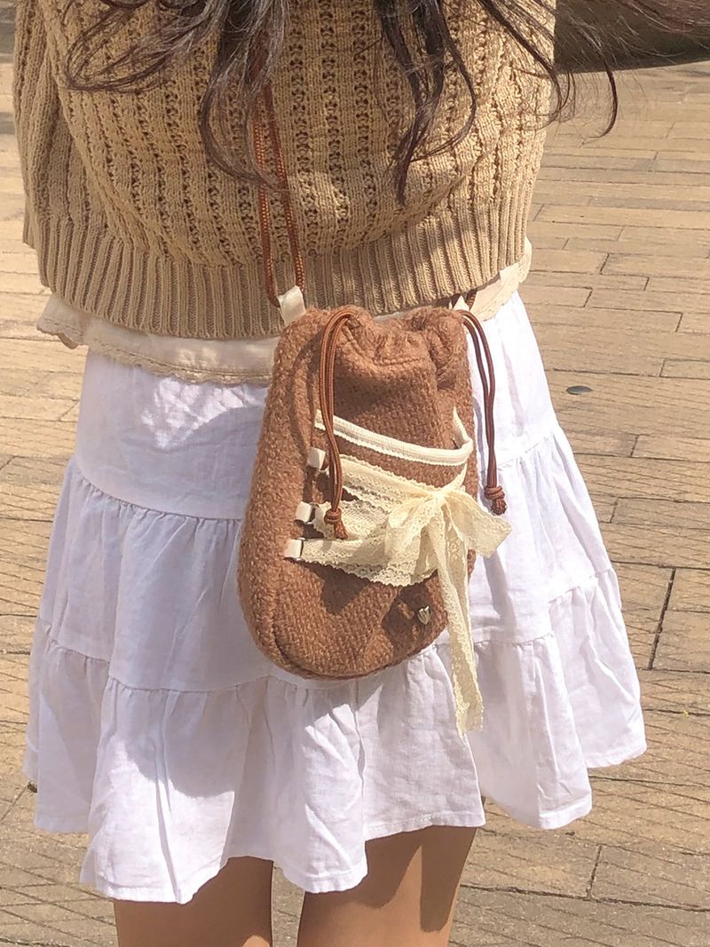 ovuni(オーブニ)の「Mini sneaker ribbon bag_moche brown (dumble)(Bags)」