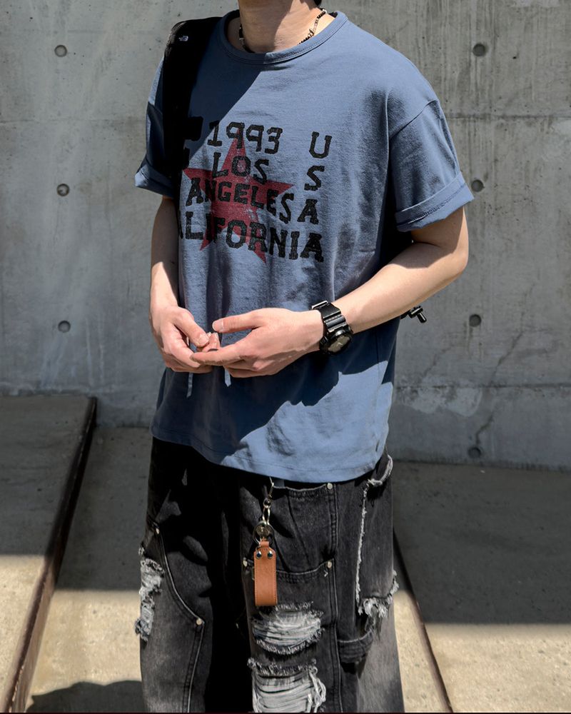 JIIGEUM（ジグム）の「Cally Vintage Graphic Cropped Short Sleeve（Tops）」