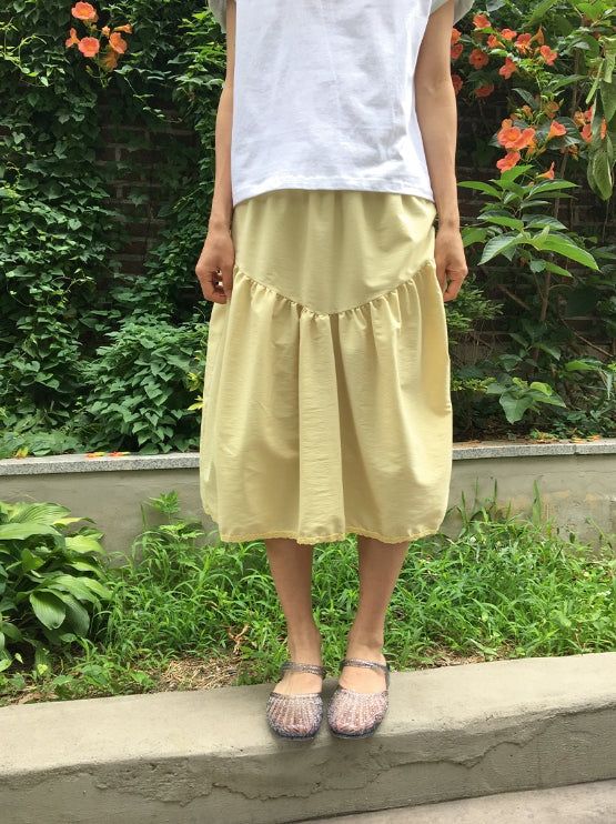 BAON（バオン）の「Kira Shirring Cut Nylon Midi Skirt（Skirts）」