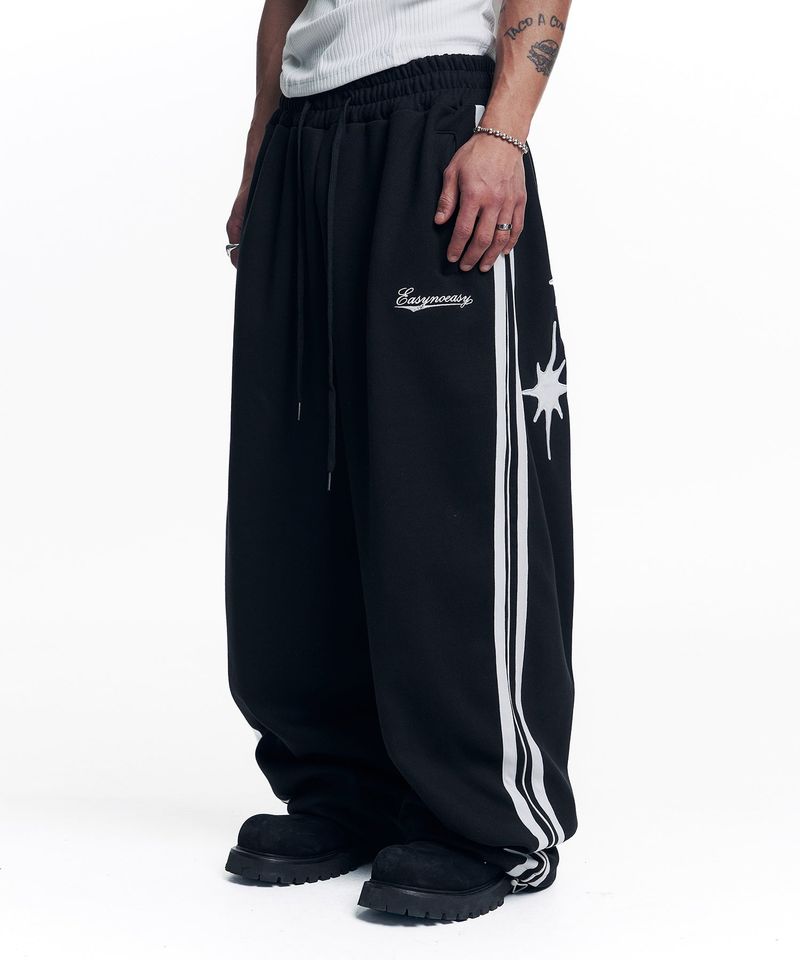 EASY NO EASY(イージーノーイージー)の「Star Piping Track Balloon Sweat Pants - Black(Pants)」