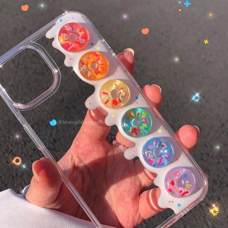 bbgr（ビービージーアール）の「レインボースイートドーナツケース（スマホグッズ/小物）」