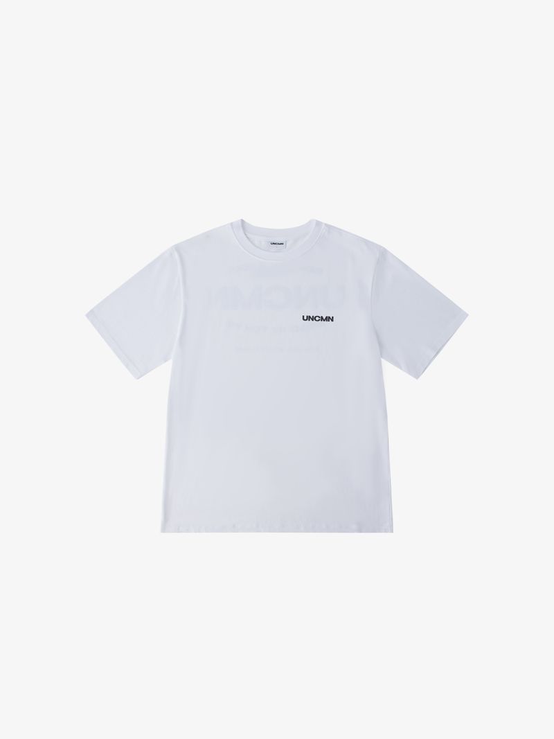 UNCMN（アンカモン）の「LOGO T-SHIRT WHITE（Tops）」