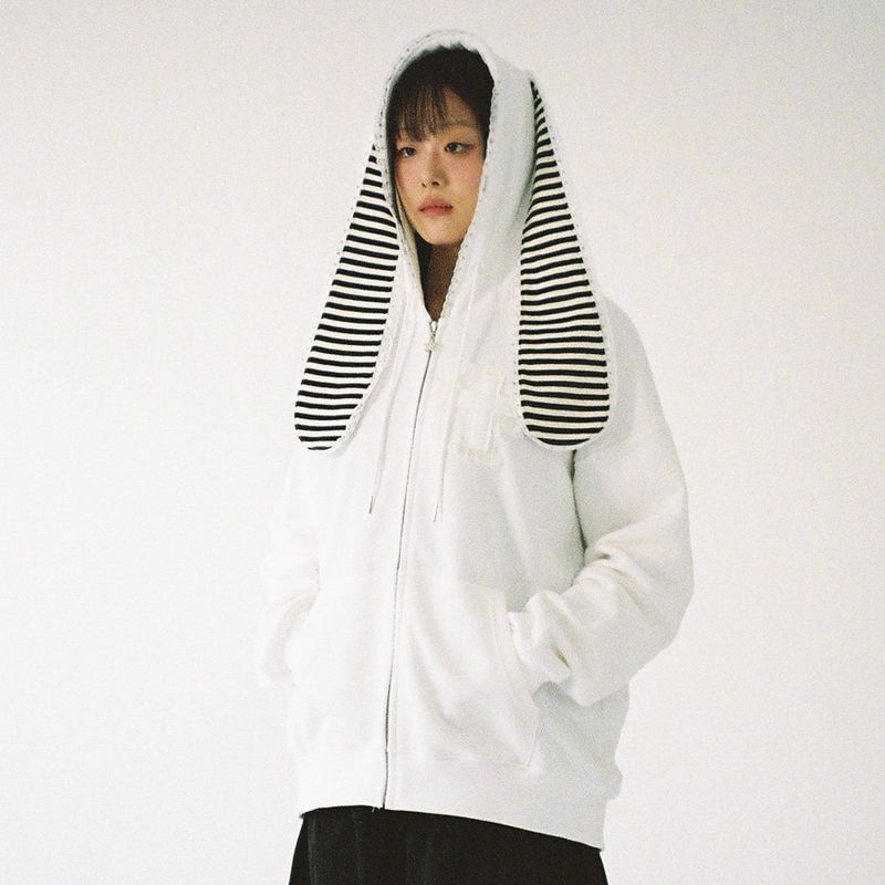 CLUT STUDIO（クラットスタジオ）の「Cross Bunny Ear Zip-Up Hoodie - White（Tops）」