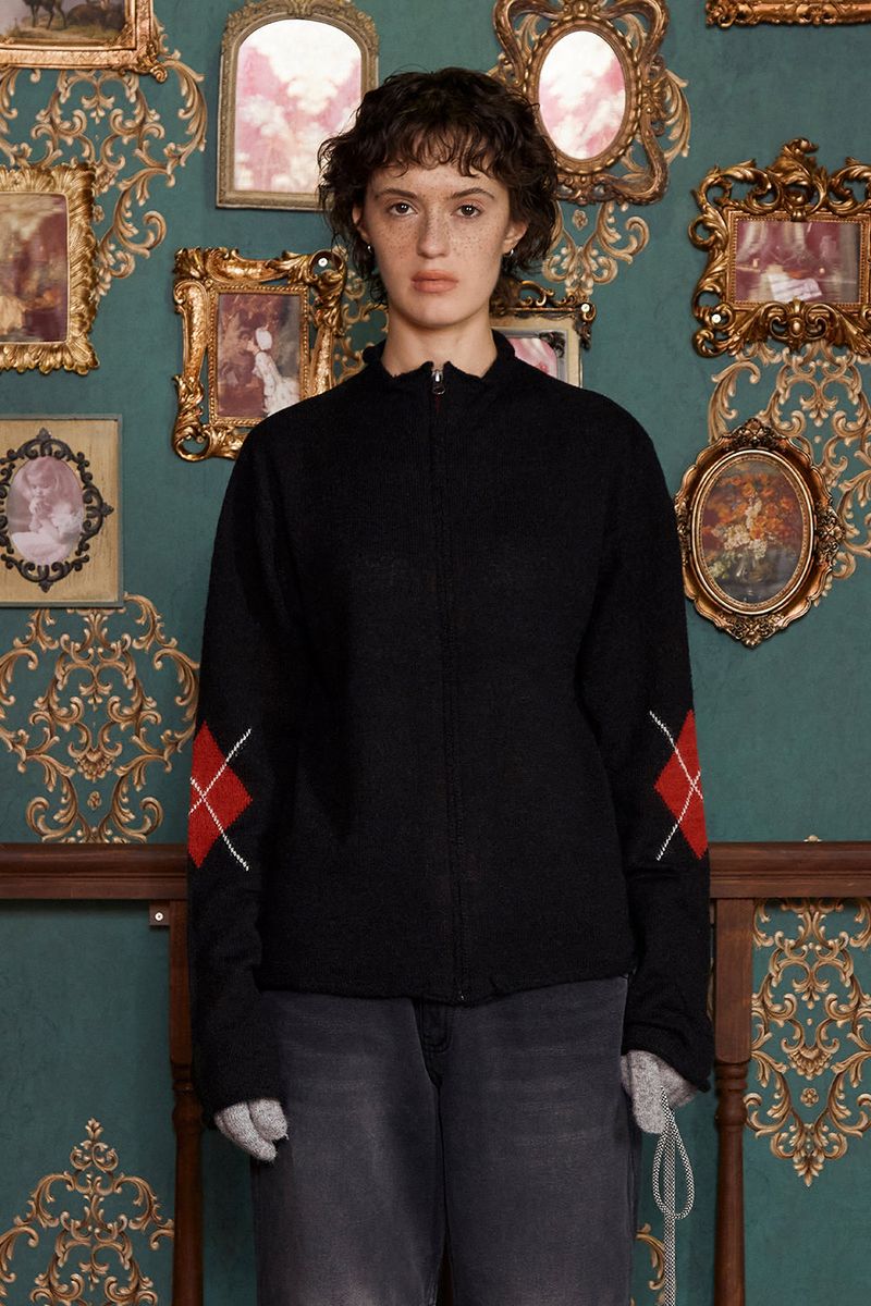 UNALLOYED（アナロイド）の「ARGYLE ZIP-UP KNIT / BLACK（Tops）」