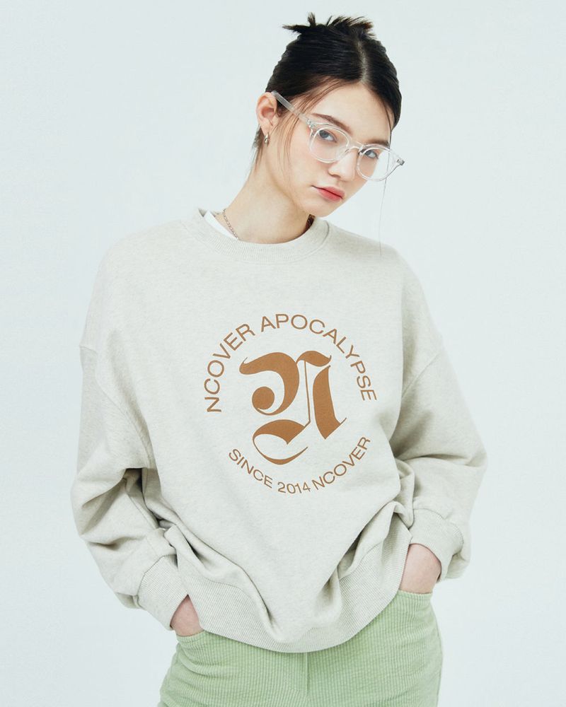 NCOVER(エンカバー)の「ROMAN TYPO LOGO SWEATSHIRT-BEIGE(Tops)」