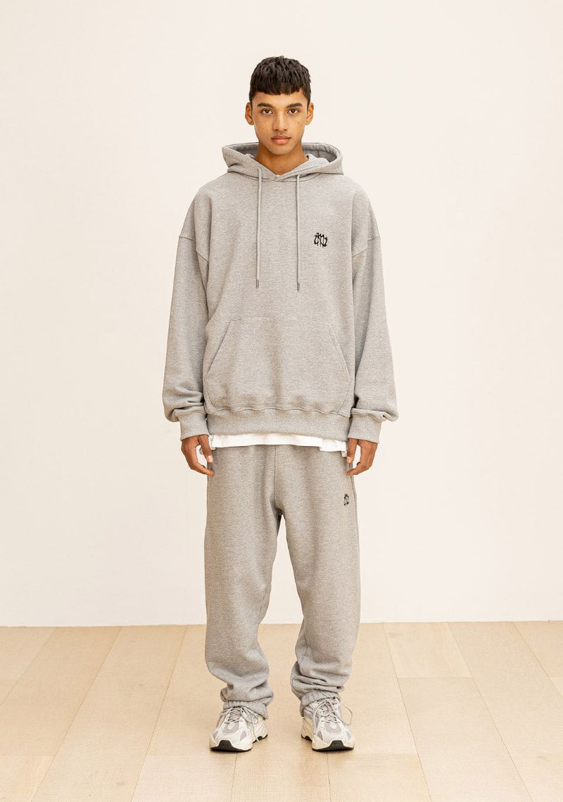 GRATING EMBLEM BACK SLIT ZIP PANTS