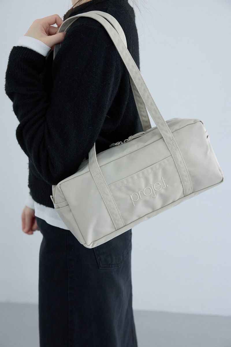 compact duffle bag (light beige)