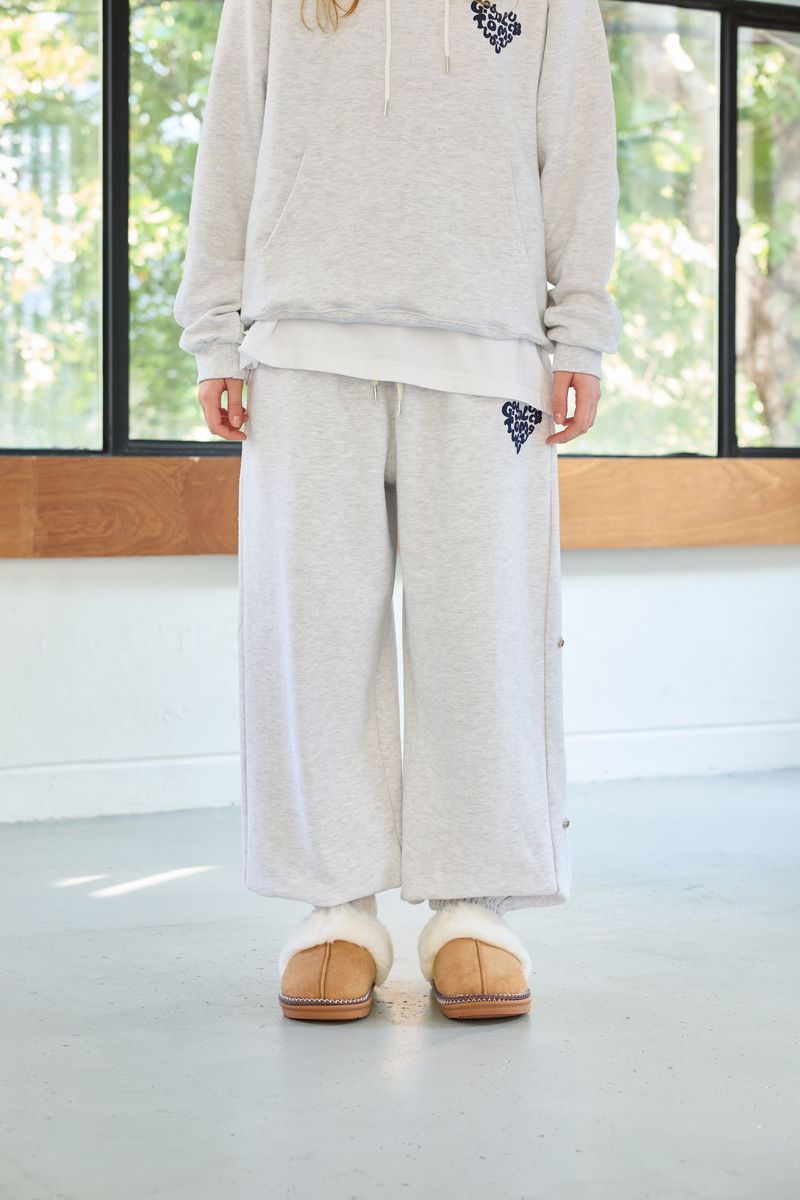 ARIKIM（アリキム）の「GOODLUCK HEART SNAP OFF SWEAT PANTS / WHITE-MELANGE（Pants）」