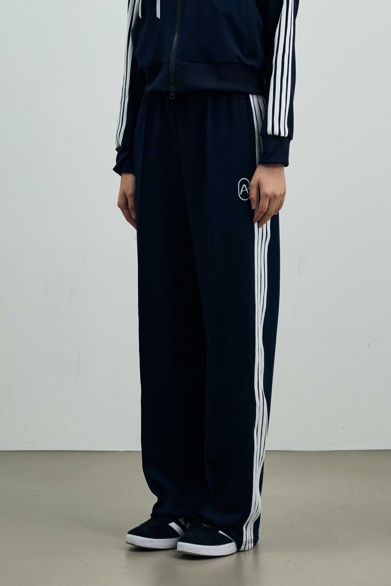 ARIKIM（アリキム）の「RIBBON JERSEY TRACK PANTS / NAVY（Pants）」
