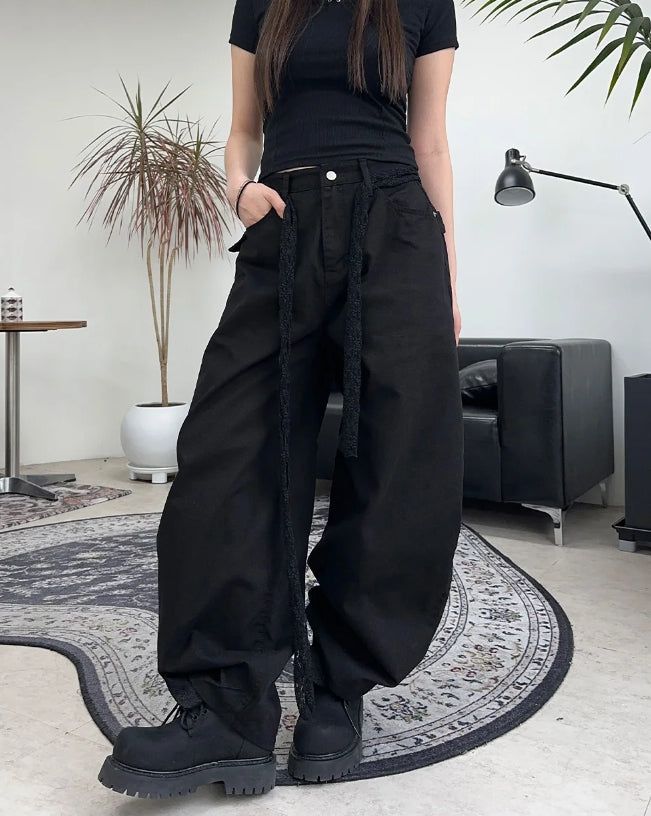 Pale studded strap pants