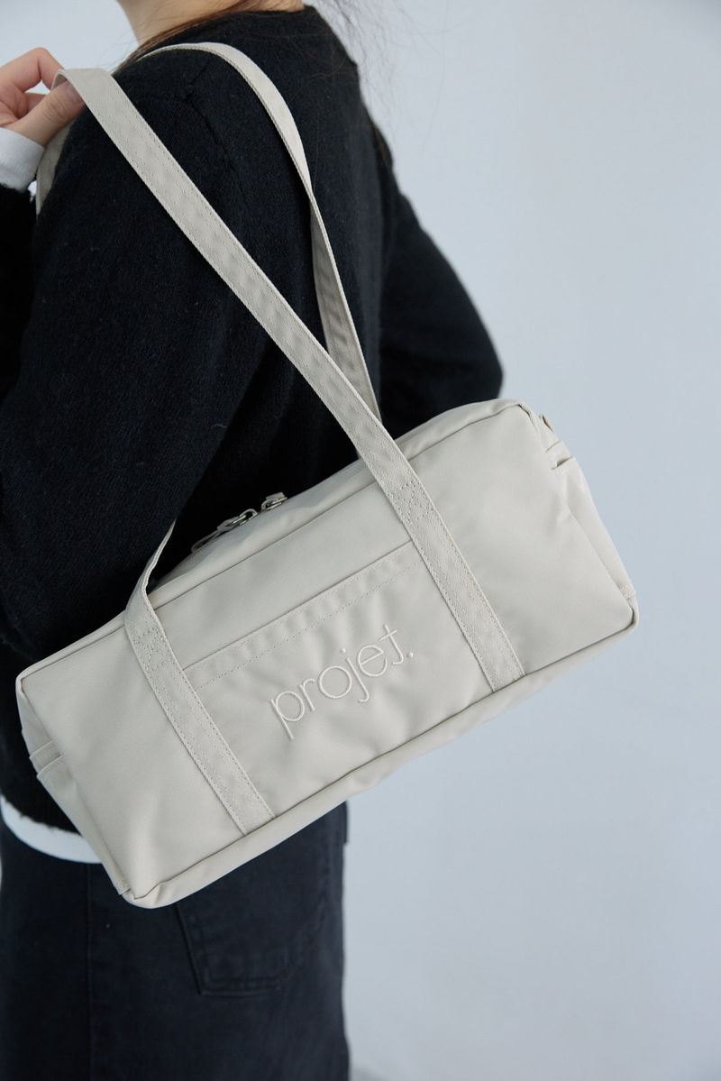 compact duffle bag (light beige)