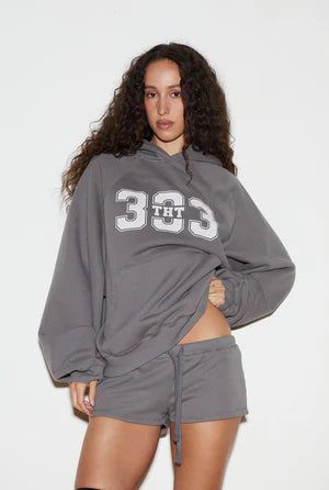 threetimes（スリータイムズ）の「Sporty 333 hoodie - charcoal（Tops）」