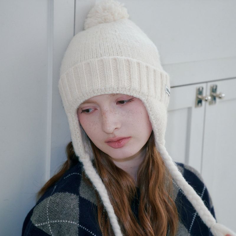 ALLINCOMPLETE（オールインコンプリート）の「Folded Bell Earflap Beanie (Cream)（Hats）」