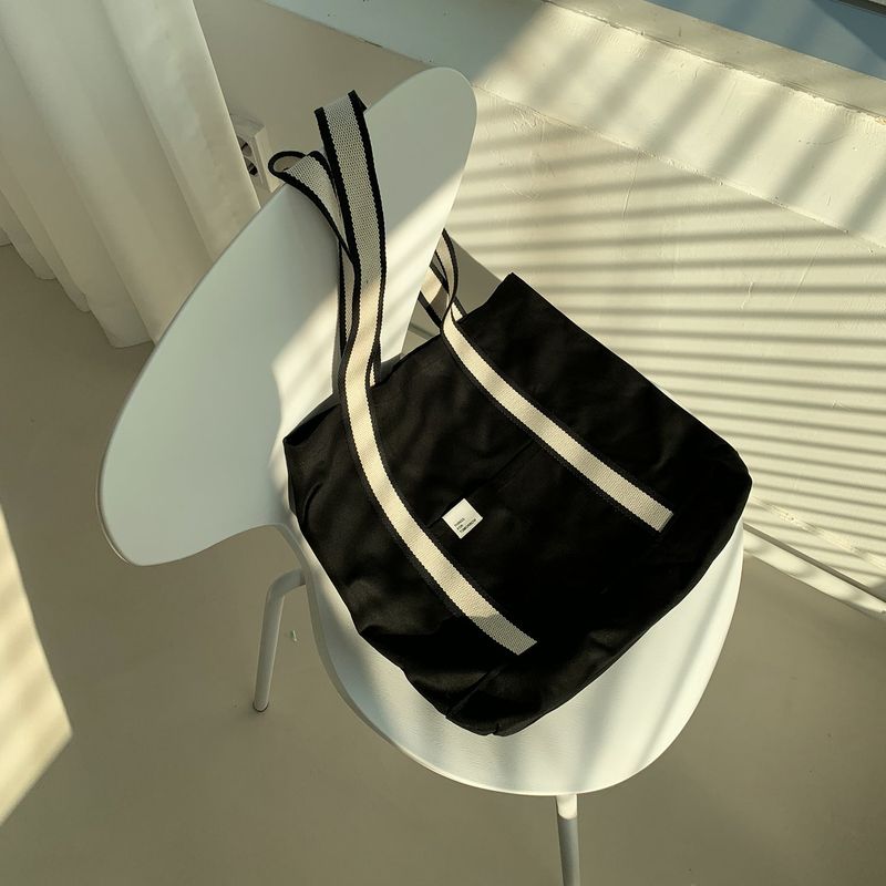 White on black tote bag