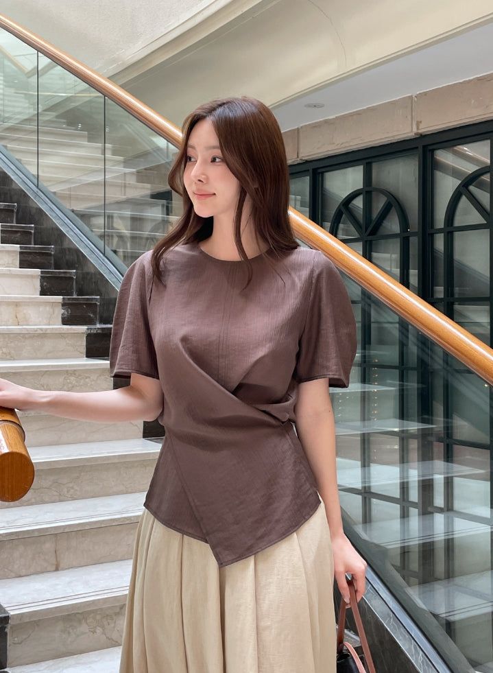 iam mari（アイアム マリ）の「Illien Round Cross Wrap Blouse（Tops）」
