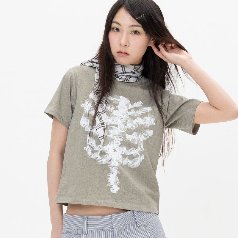 WEBHOUSE（ウェブハウス）の「Lace Bone Angel Tee - Khaki（Tops）」