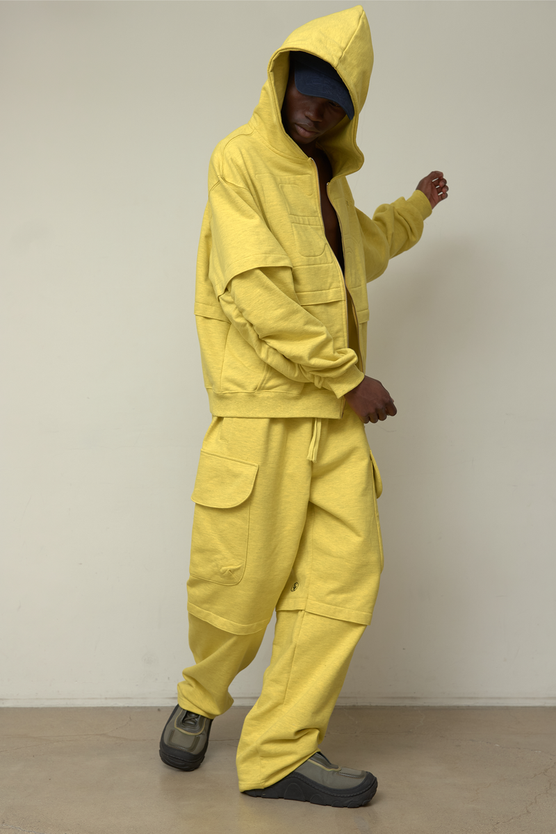 ER(EEERRR)（イーアール）の「Back point shirring hood zip-up (Melange Yellow)（Tops）」