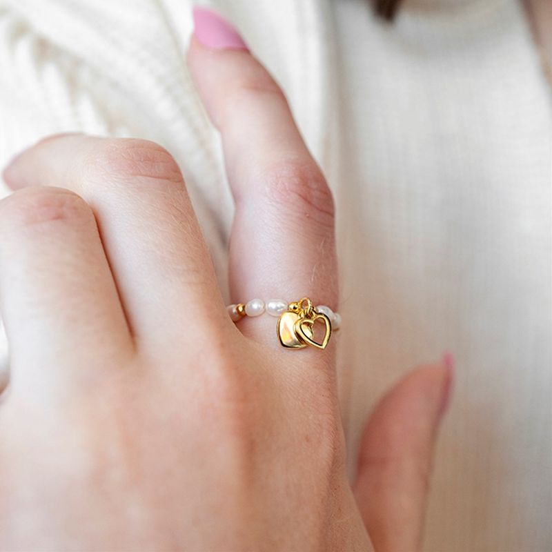 L'OMBRILLANT（ロムブリラント）の「Double heart charm pearl ring（Accessories）」