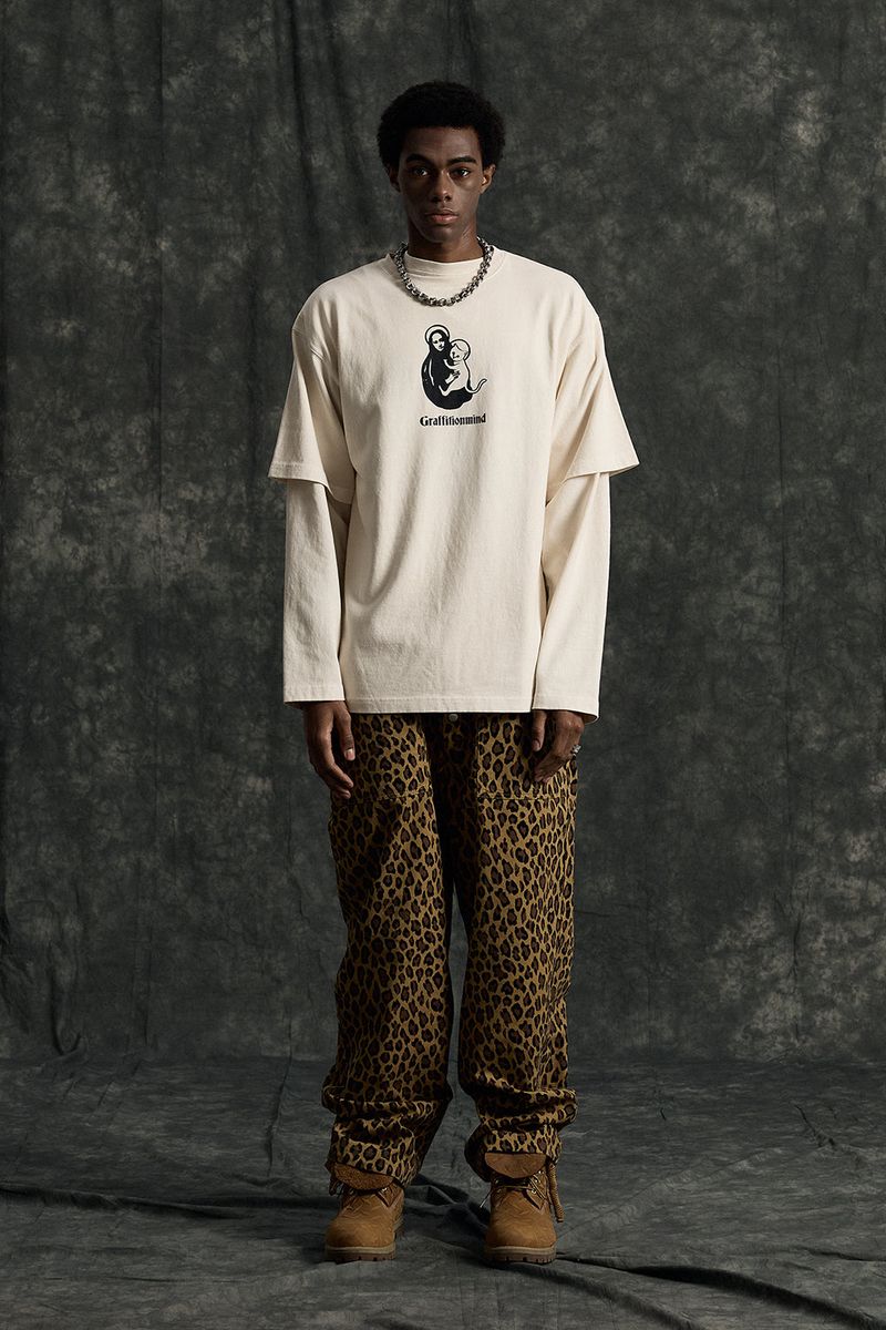 GRAFFITIONMIND（グラフィティオンマインド）の「Cat Pigment T-shirt (Cream)（Tops）」