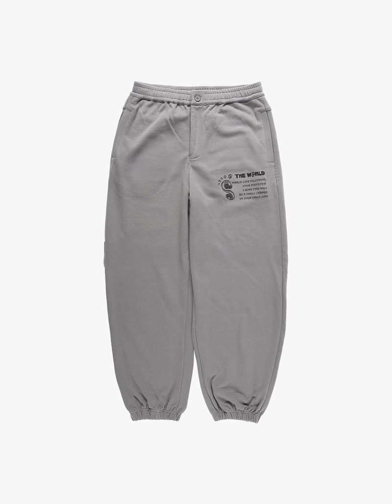thewarld（ザワールド）の「フットプリントロゴスウェットパンツ チャコール（パンツ）」