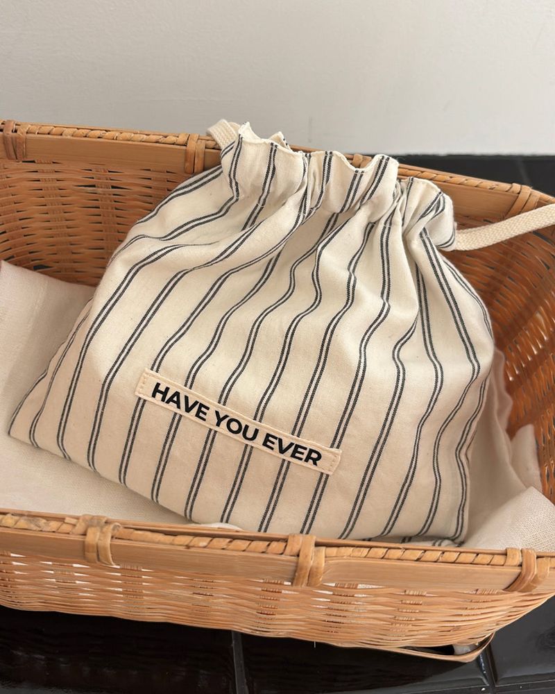 HAVE YOU EVER（ハヴユーエバー）の「Pattern string pouch - beige stripe , S size（Accessories）」