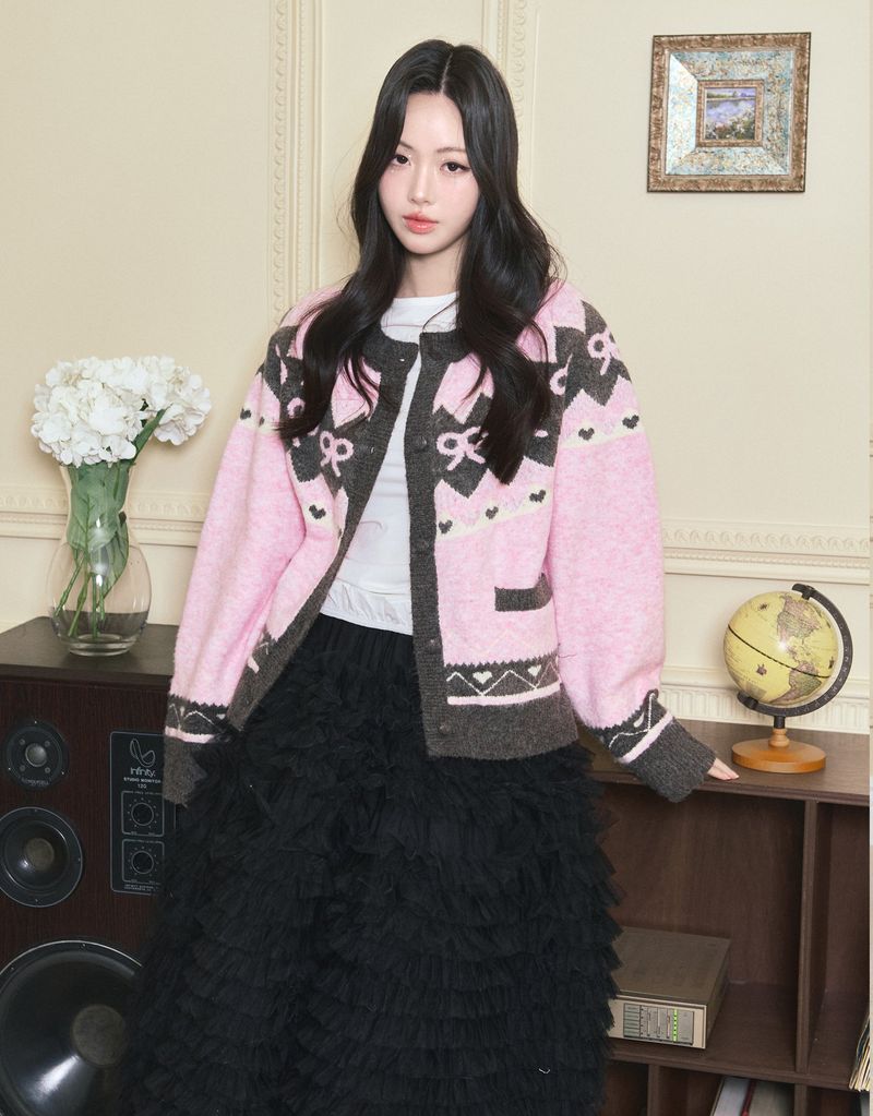 TWEEDY-A（ツウィーディア）の「Roslyn Ribbon Cowichan Knit Cardigan Pink（Tops）」