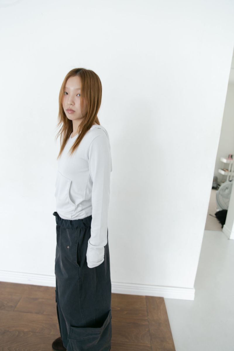 omoosoohy（オムスヒ）の「snug hood pocket top(3colors)（Tops）」