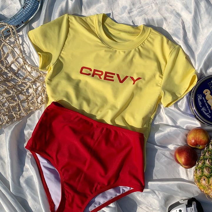 CREVY(クレビー)の「crevy logo crop spandex short sleeve tee (yellow)(Tops)」