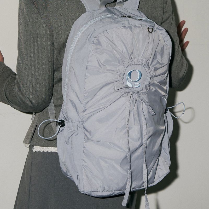 poie（ポイエ）の「ホールストリングピーオーバックパック(blue grey)（バッグ）」
