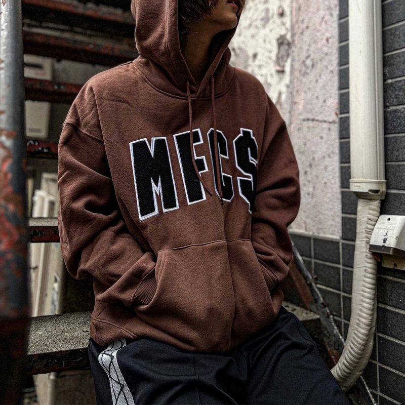 MFC STORE（エムエフシー ストア）の「MFC STORE 'MFC$' アーチロゴ フーディー（トップス）」
