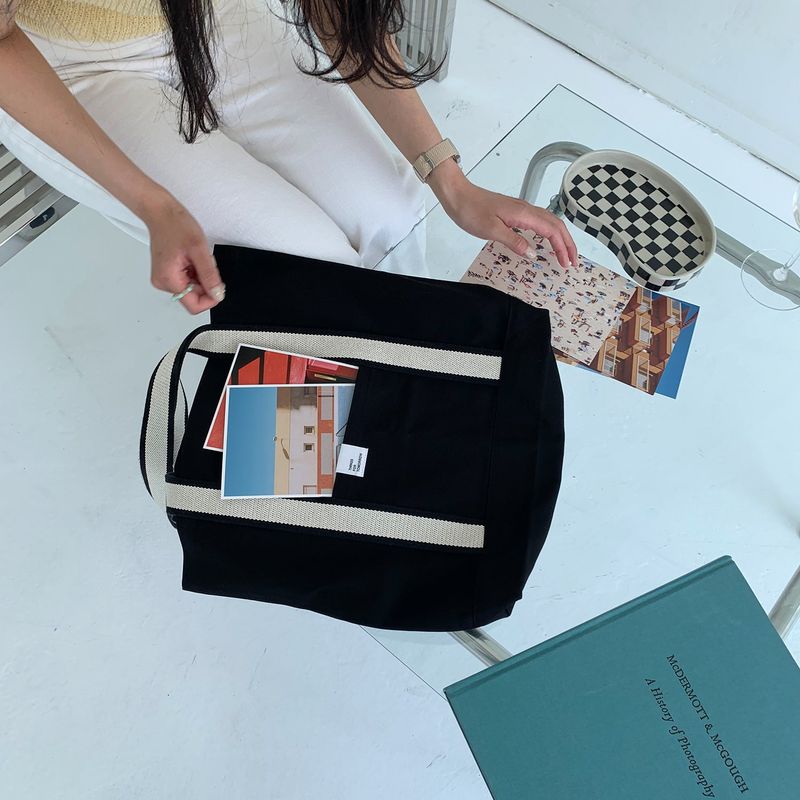 White on black tote bag